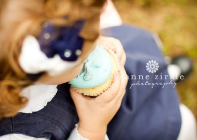 overhead-view-of-little-girl-with-cupcake